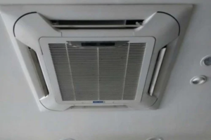 Technician installing centralized HVAC system in Dubai