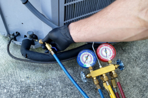 Technician performing Freon gas charging in Dubai