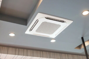 Technician repairing window AC unit in Dubai
