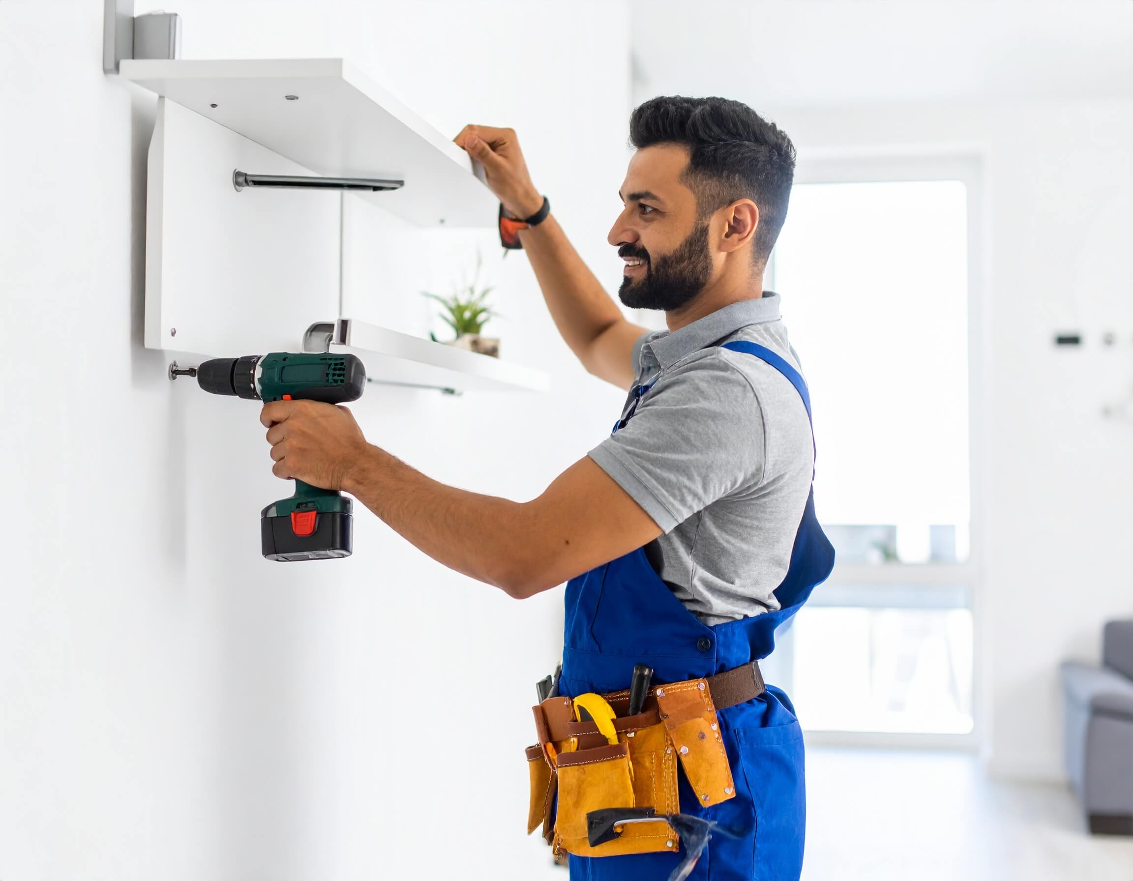 Professional handyman working in a modern Dubai apartment