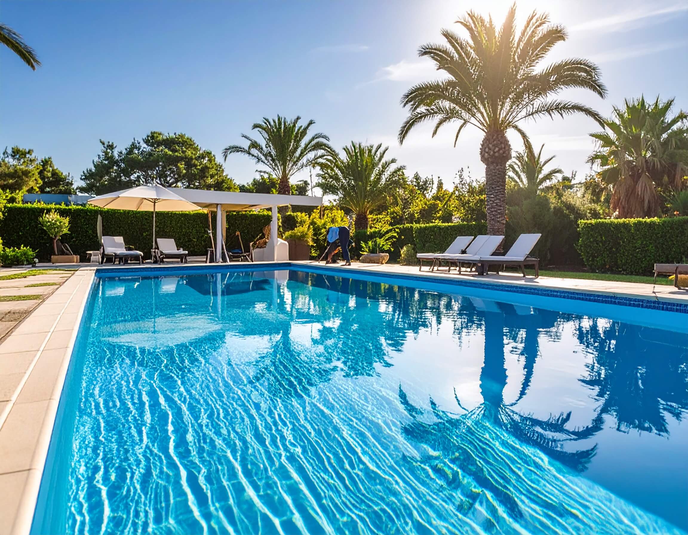 Luxurious swimming pool with garden, decking and lounge